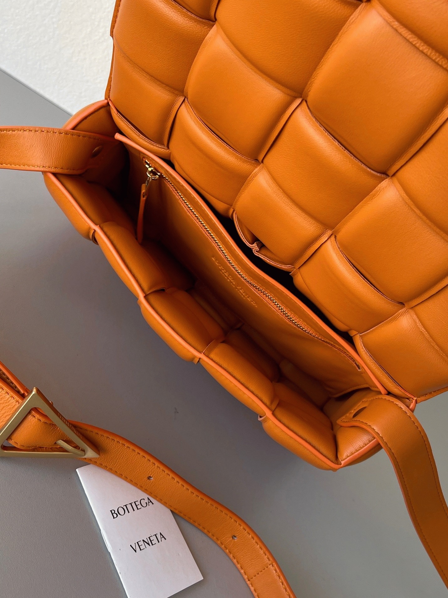 Top Quality Faux B0tt*ga Ven*ta Padded Cassette Bag In Orange