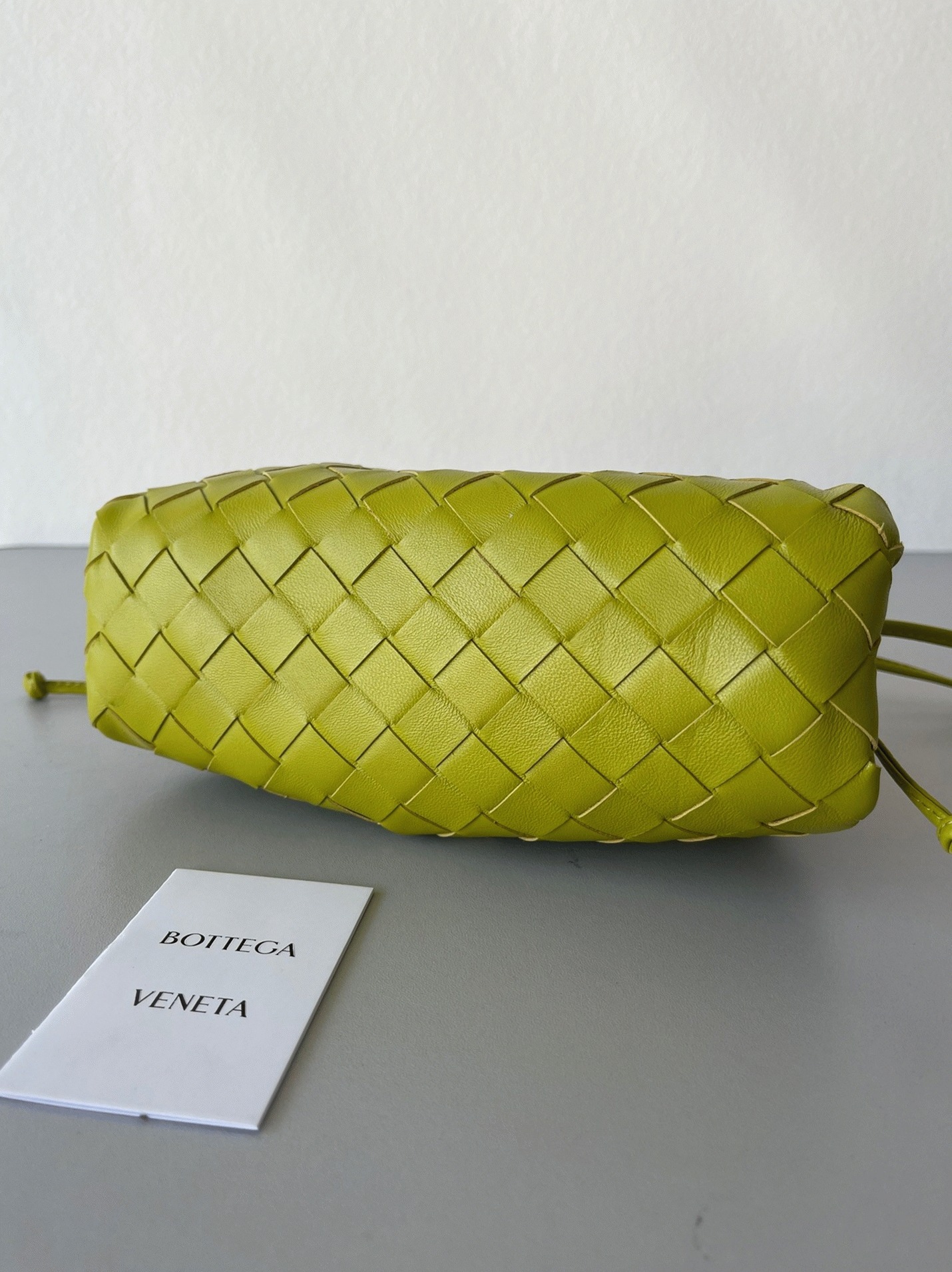 Fake B0tt*ga Ven*ta Mini Pouch with Strap Kiwi