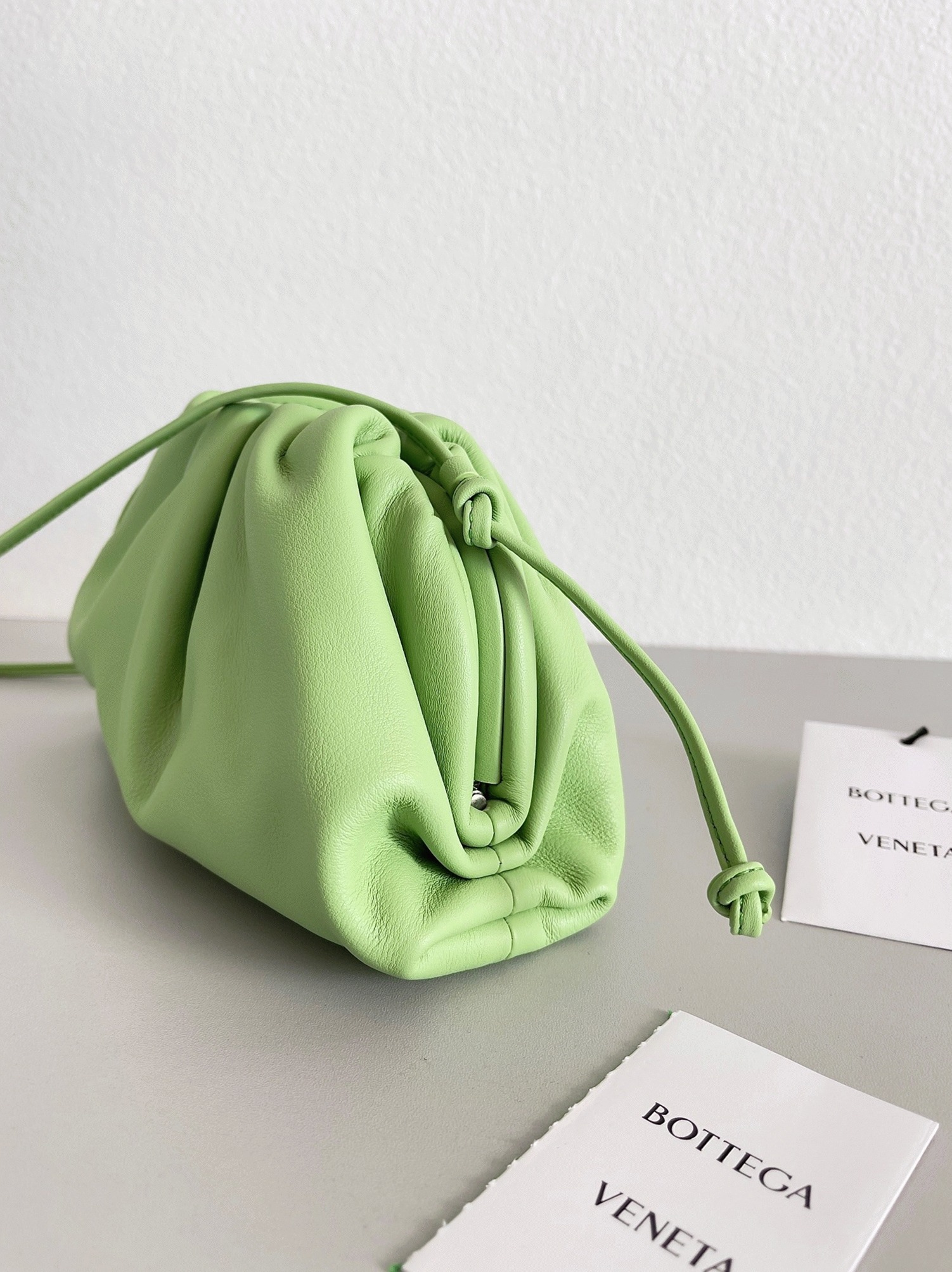 Fake B0tt*ga Ven*ta Mini Pouch with Strap Pistachio