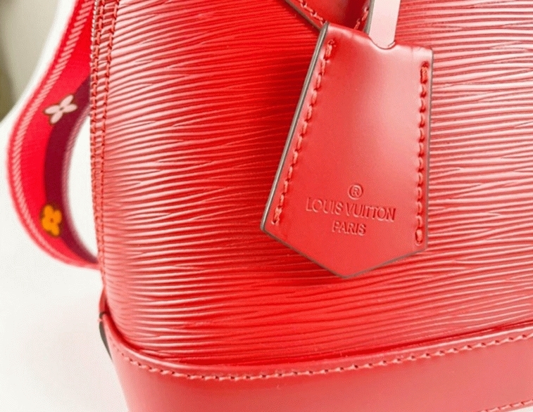 L0vis Vvtt0n Epi Leather Alma BB Handbag In Red With Jacquard Strap