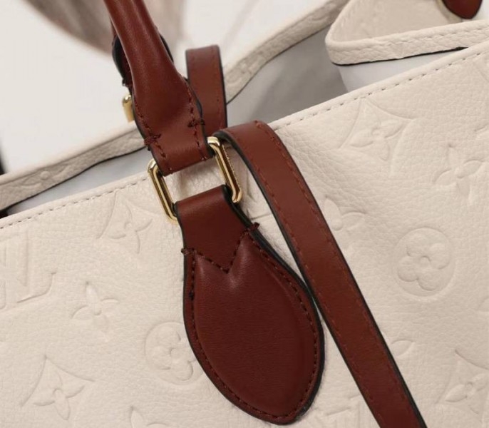 L0vis Vvtt0n Monogram Empreinte Onthego GM Tote In Cream