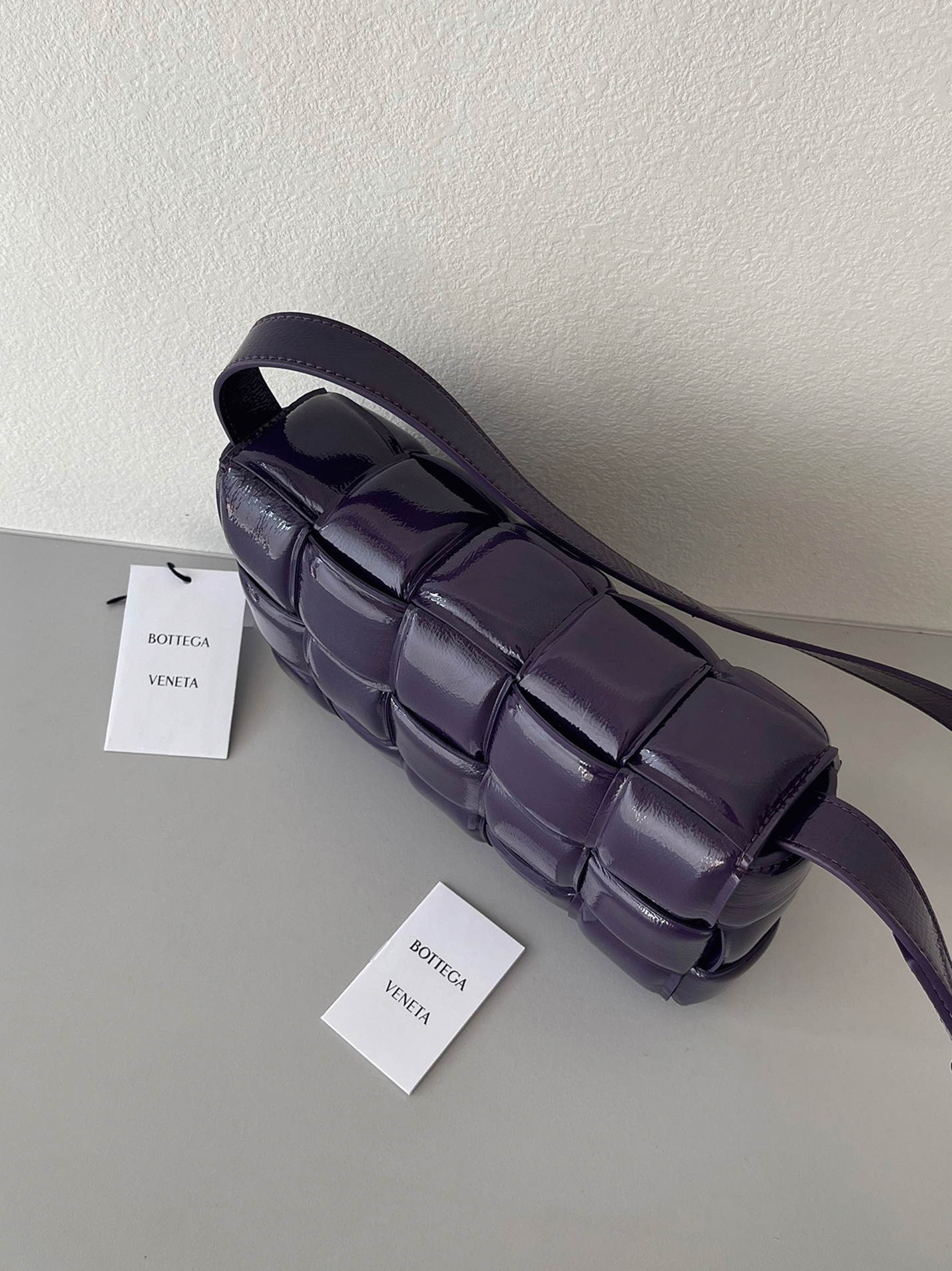 Top Quality Fake B0tt*ga Ven*ta Padded Cassette Bag In Purple