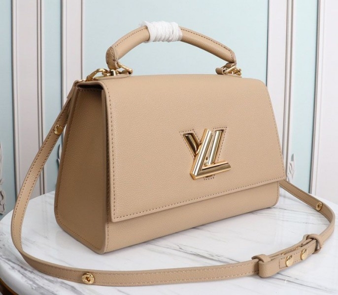L0vis Vvtt0n Twist One Handle MM Handbag In Beige