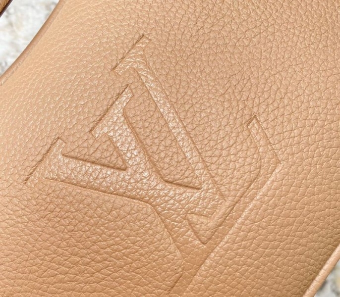 L0vis Vvtt0n Monogram Empreinte Leather Bagatelle Mini Hobo In Beige