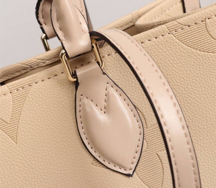 L0vis Vvtt0n Monogram Empreinte Giant Onthego MM Bag In Beige