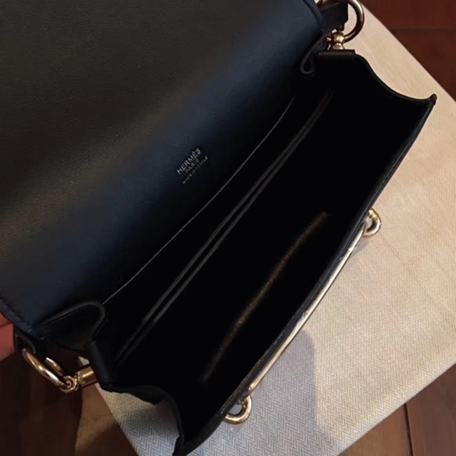 Black knockoff H**me5 Mini Sac Roulis handbag