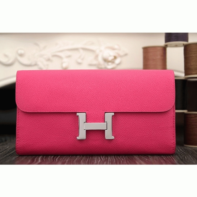 Peach knockoff H**me5 Constance wallet