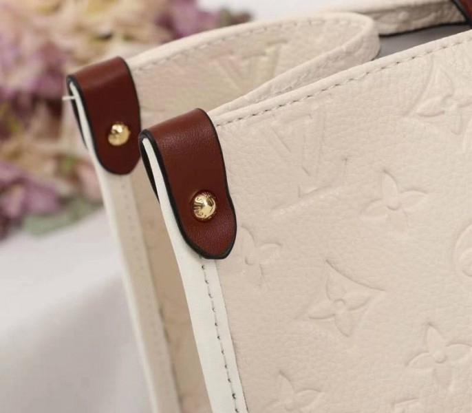 L0vis Vvtt0n Monogram Empreinte Onthego GM Tote In Cream