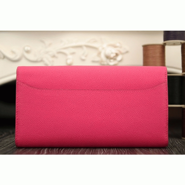 Peach knockoff H**me5 Constance wallet