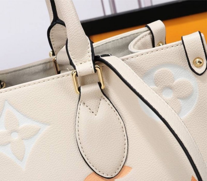 L0vis Vvtt0n Monogram Empreinte Leather Onthego MM Bag In Cream Saffron