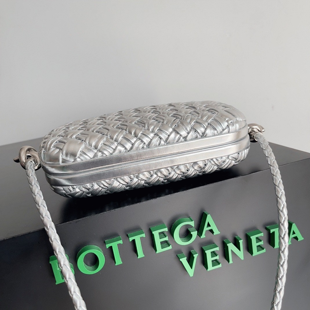 Fake B0tt*ga Ven*ta Knot Minaudiere On Strap Silver Intreccio Laminated Leather