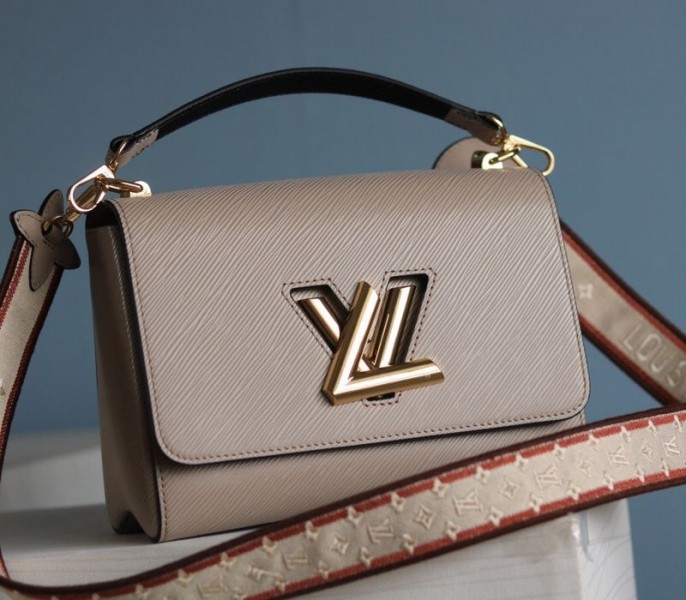 L0vis Vvtt0n Epi Leather Twist MM Handbag In Galet Gray With Embroidered Strap