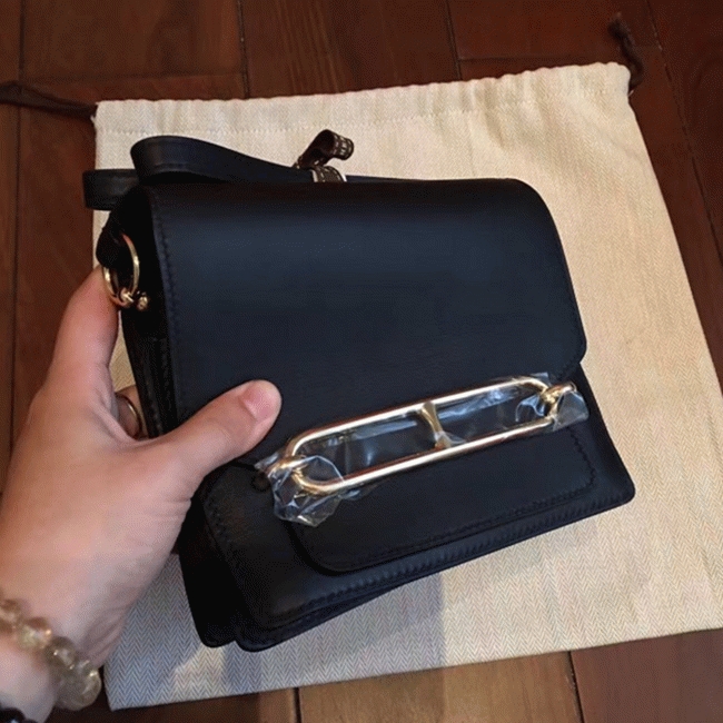 Black knockoff H**me5 Mini Sac Roulis handbag