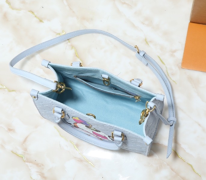 LV X TM Monogram Empreinte OnTheGo PM With Bijou Edition In Washed Blue