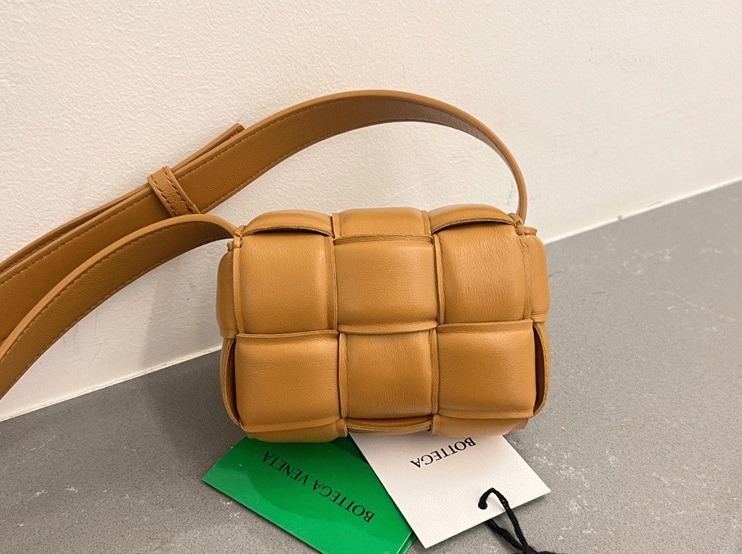 Top Quality Fake B0tt*ga Ven*ta Candy Padded Cassette Bag In Camel