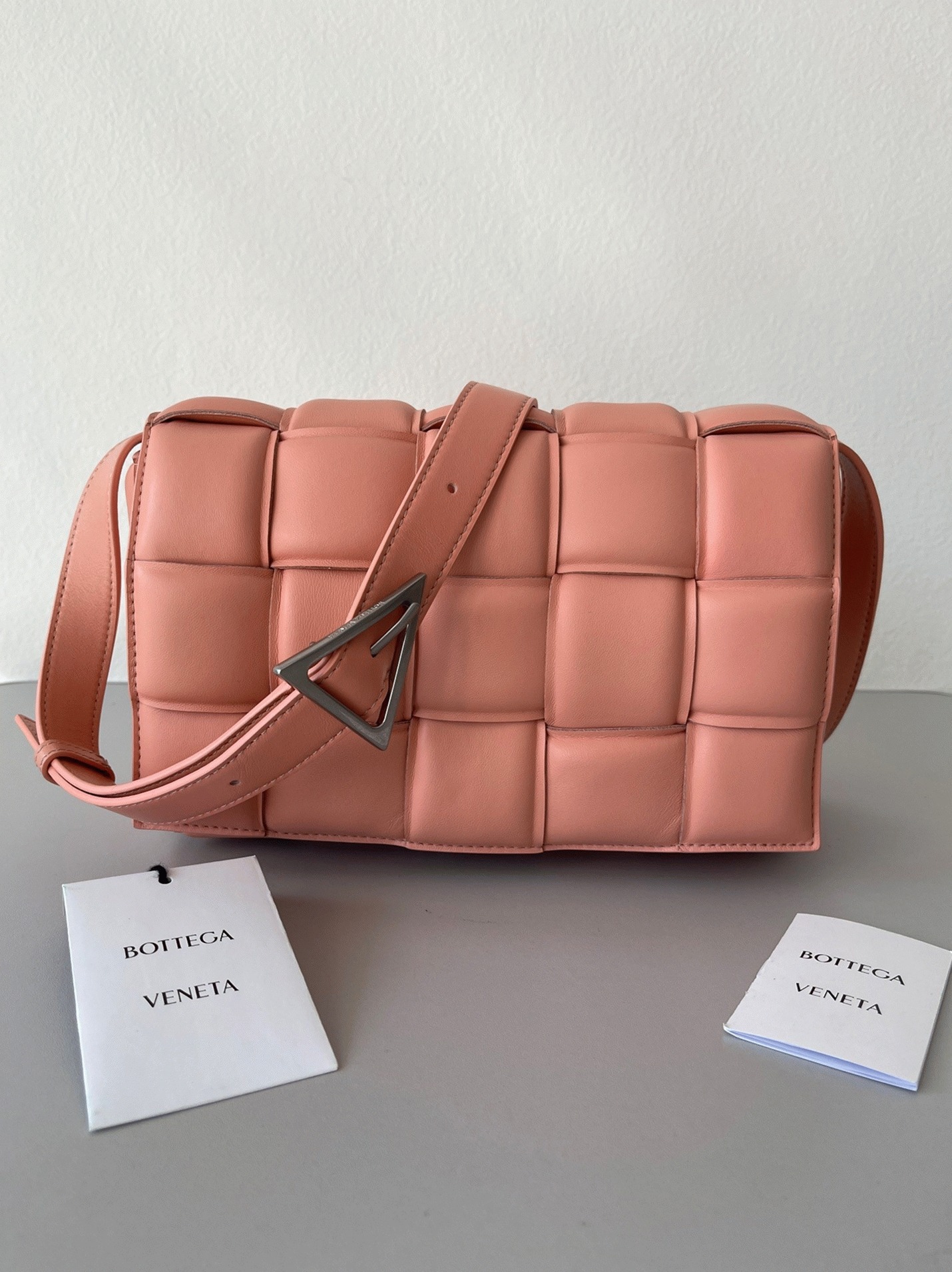 Top Quality Fake B0tt*ga Ven*ta Padded Cassette Bag In Peachy