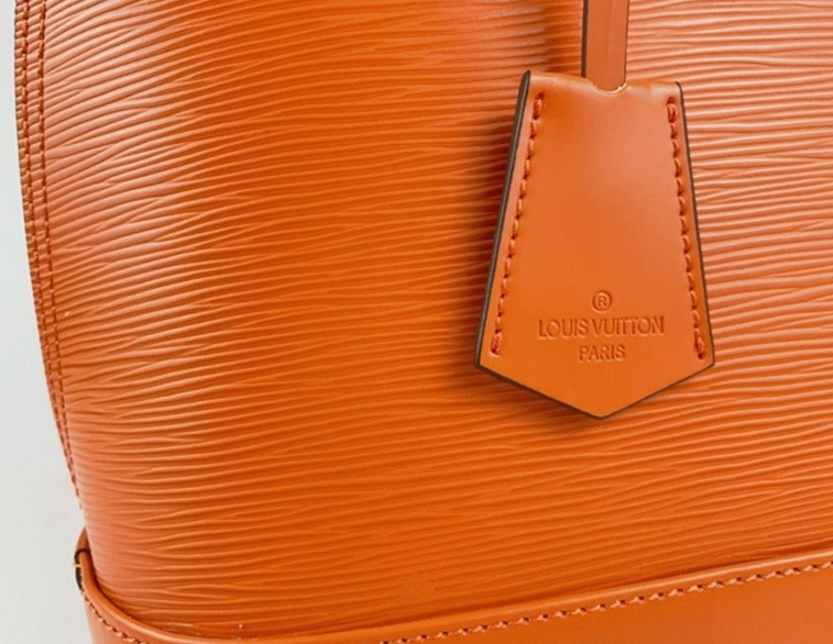 L0vis Vvtt0n Epi Leather Alma PM Handbag In Orange With Jacquard Strap