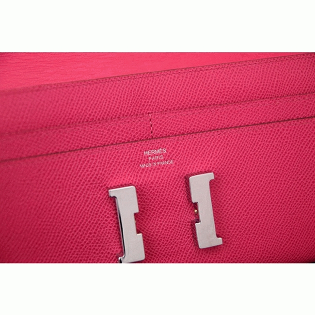 Peach knockoff H**me5 Constance wallet