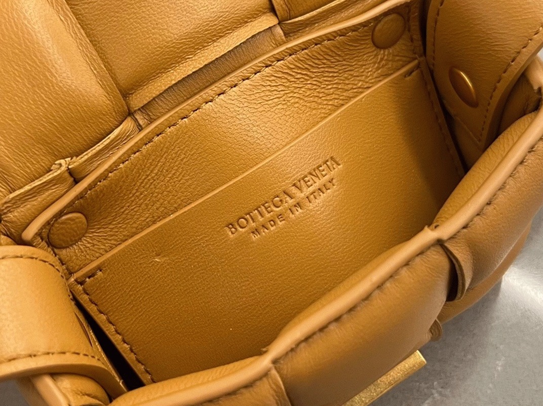 Top Quality Fake B0tt*ga Ven*ta Candy Padded Cassette Bag In Camel