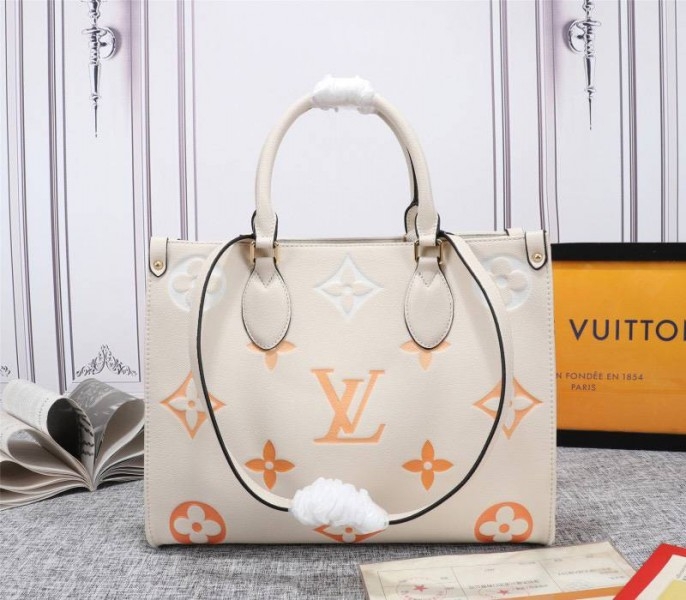 L0vis Vvtt0n Monogram Empreinte Leather Onthego MM Bag In Cream Saffron