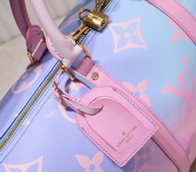 l0vis vvtt0n spring 2022 keepall 45 lU*gage in sunrise pastel