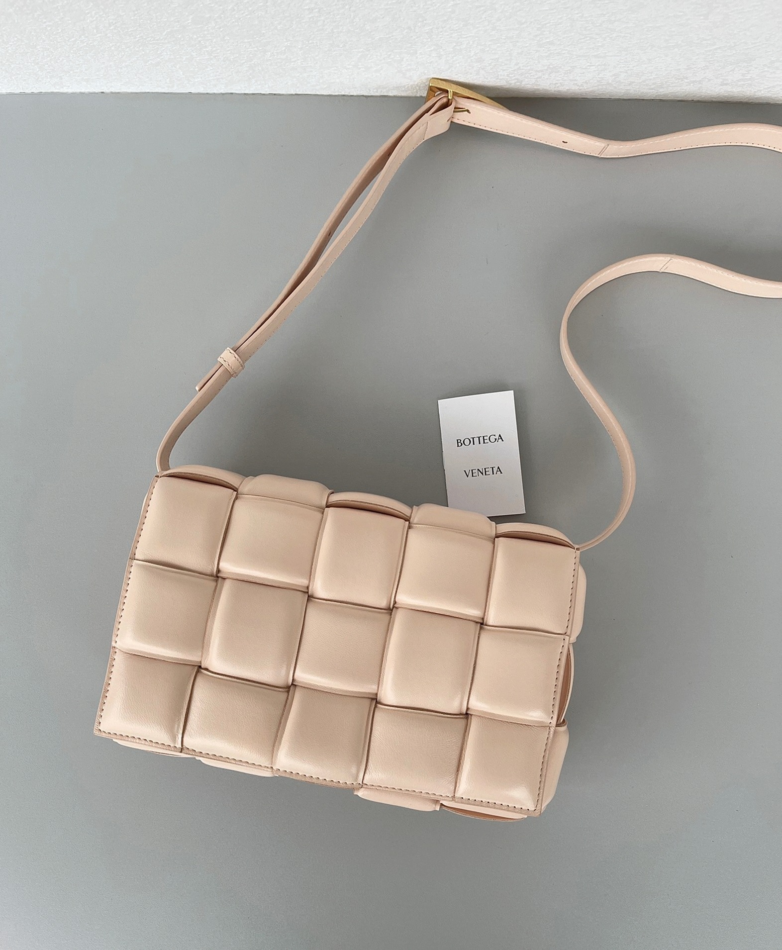 Top Quality Fake B0tt*ga Ven*ta Padded Cassette Bag In Melon