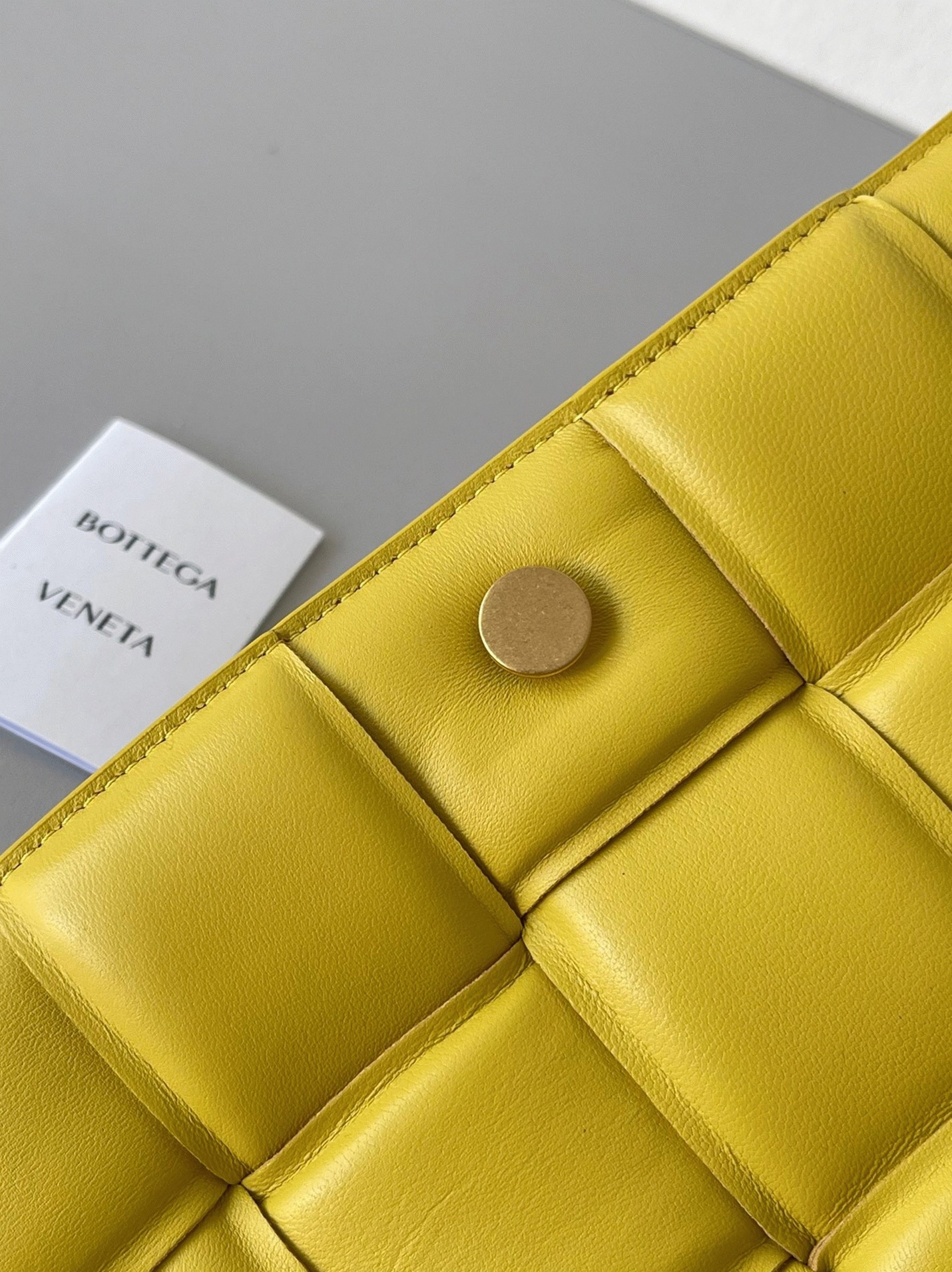 Top Quality Fake B0tt*ga Ven*ta Padded Cassette Bag In Yellow