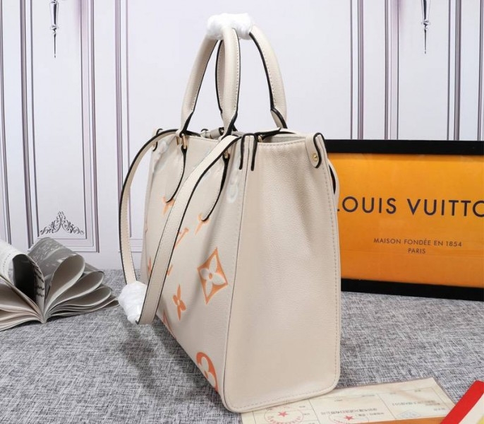 L0vis Vvtt0n Monogram Empreinte Leather Onthego MM Bag In Cream Saffron