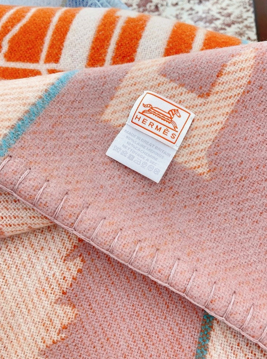 Faux H**me5 Avalon Epopee blanket in mandarine wool and cashmere