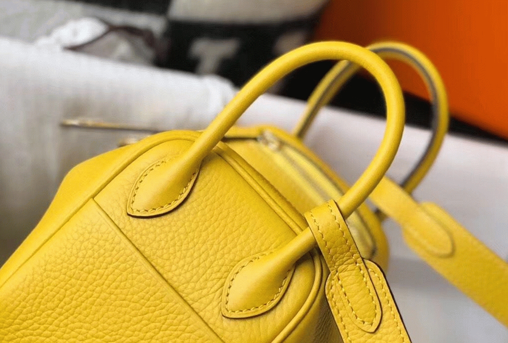 Fake luxury H**me5 Lindy Mini handbag in yellow clemence leather