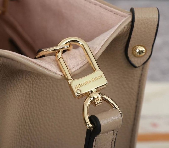 L0vis Vvtt0n Bicolor Monogram Empreinte Leather Onthego PM Bag In Tourterelle Gray And Cream