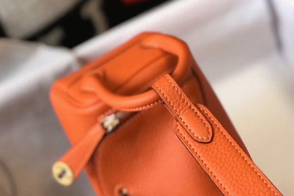 Replica H**me5 Lindy Mini handbag in orange color