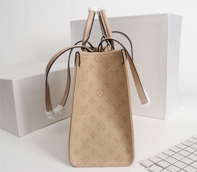 L0vis Vvtt0n Monogram Empreinte Giant Onthego MM Bag In Beige
