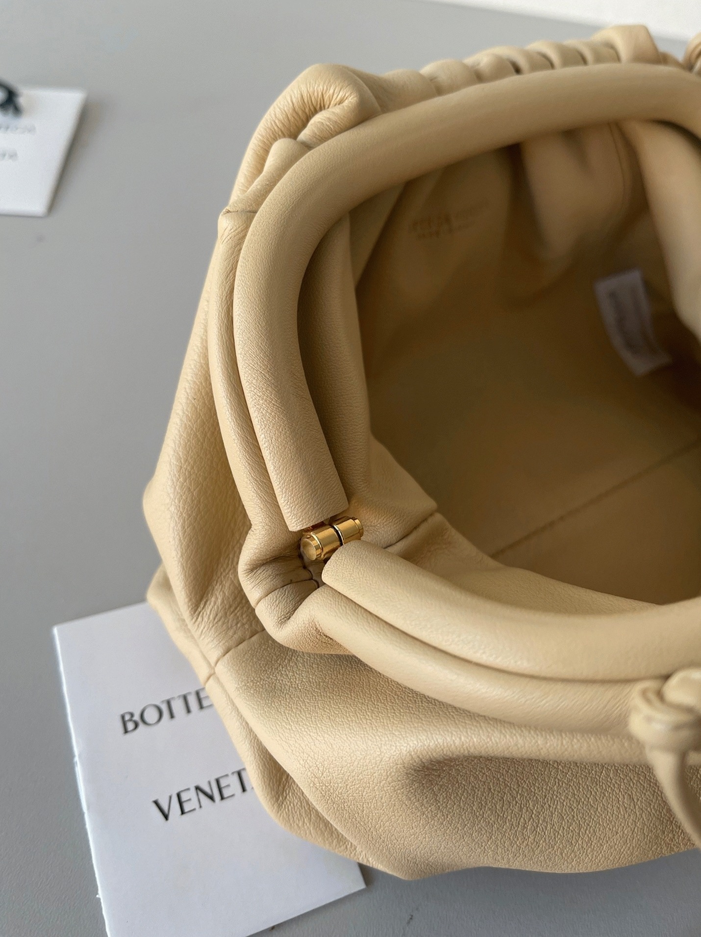 Fake B0tt*ga Ven*ta Mini Pouch with Strap Almond