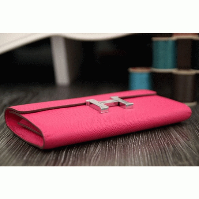 Peach knockoff H**me5 Constance wallet