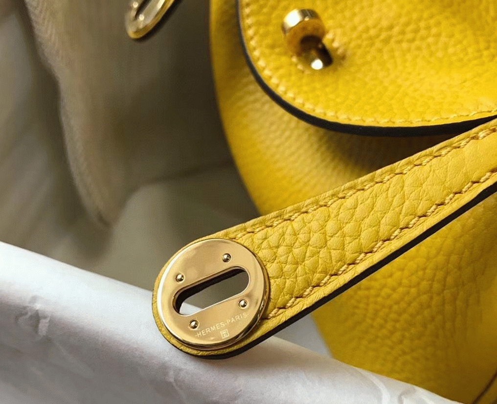 Fake luxury H**me5 Lindy Mini handbag in yellow clemence leather