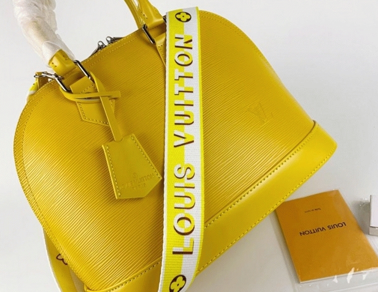 L0vis Vvtt0n Epi Leather Alma PM Handbag In Cedrat Yellow With Jacquard Strap