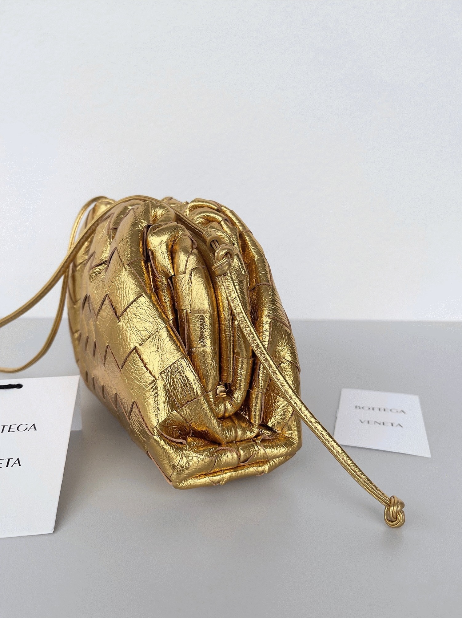 Knockoff B0tt*ga Ven*ta Mini Pouch with Strap Gold