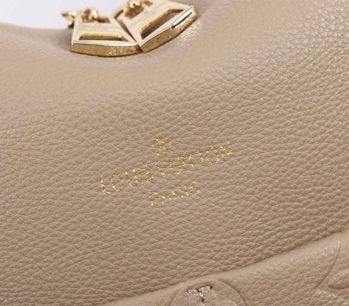 L0vis Vvtt0n Monogram Empreinte Leather Maida Hobo In Tourterelle Gray