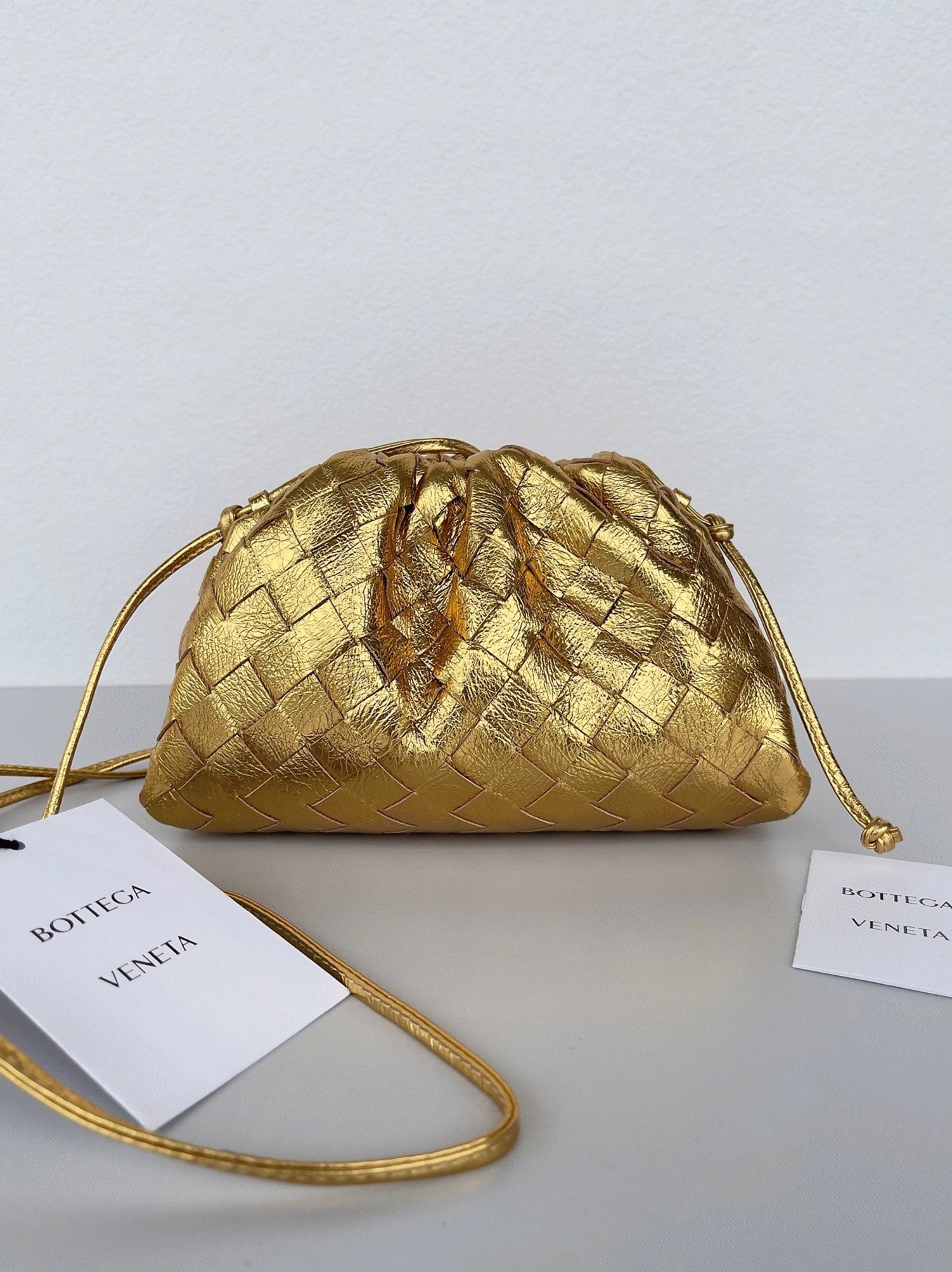 Knockoff B0tt*ga Ven*ta Mini Pouch with Strap Gold