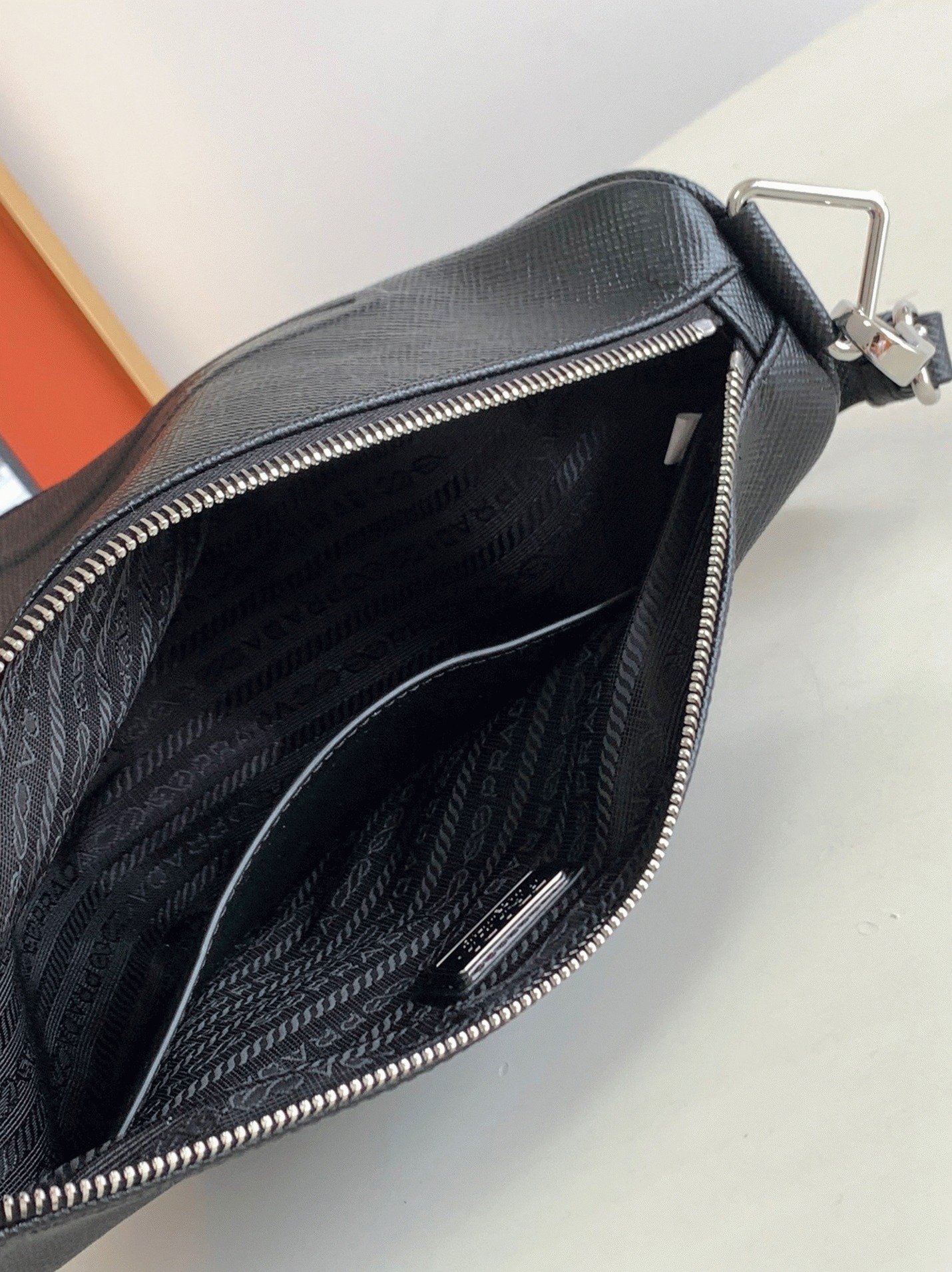 Pra*a Triangle Shoulder Bag Fake in Black