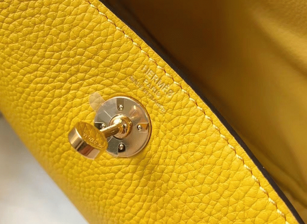 Fake luxury H**me5 Lindy Mini handbag in yellow clemence leather