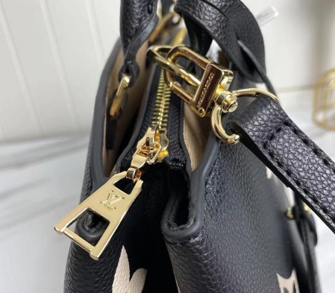 L0vis Vvtt0n Bicolor Monogram Empreinte Leather Petit Palais Handbag In Black And Beige