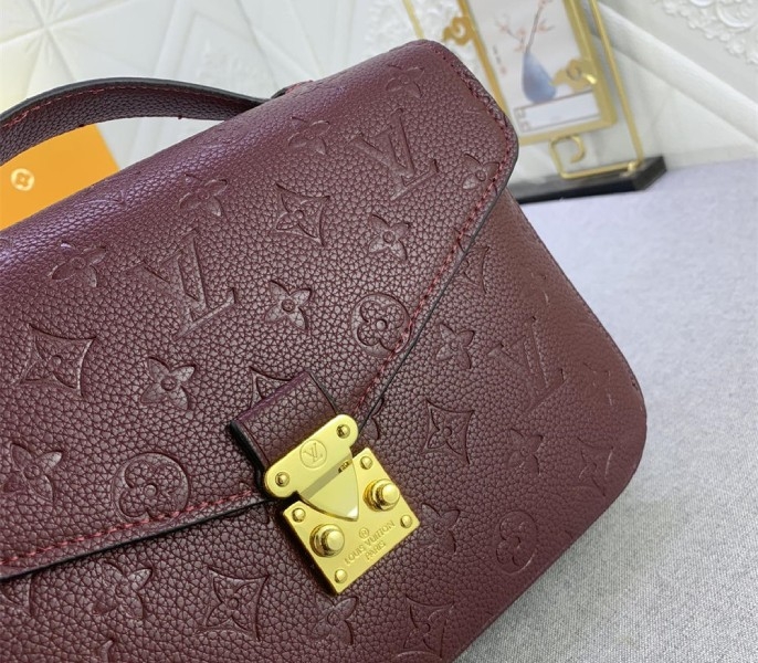 LV Monogram Empreinte Leather Metis In Wine