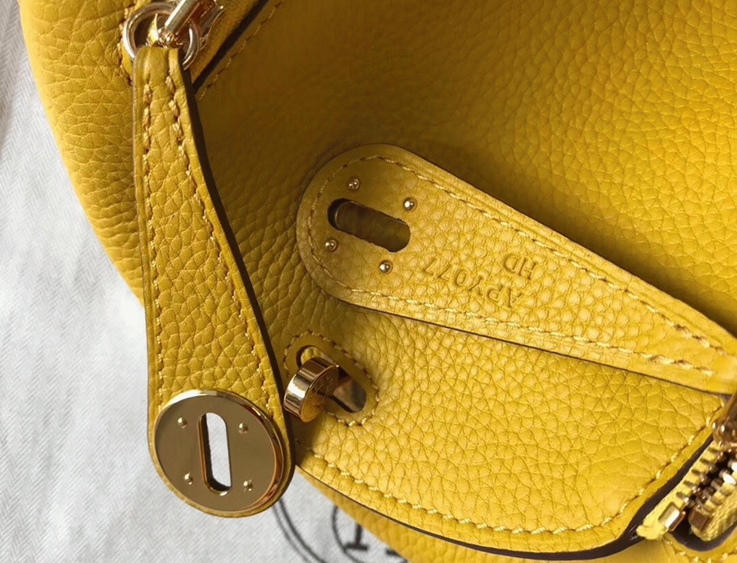 Fake luxury H**me5 Lindy Mini handbag in yellow clemence leather
