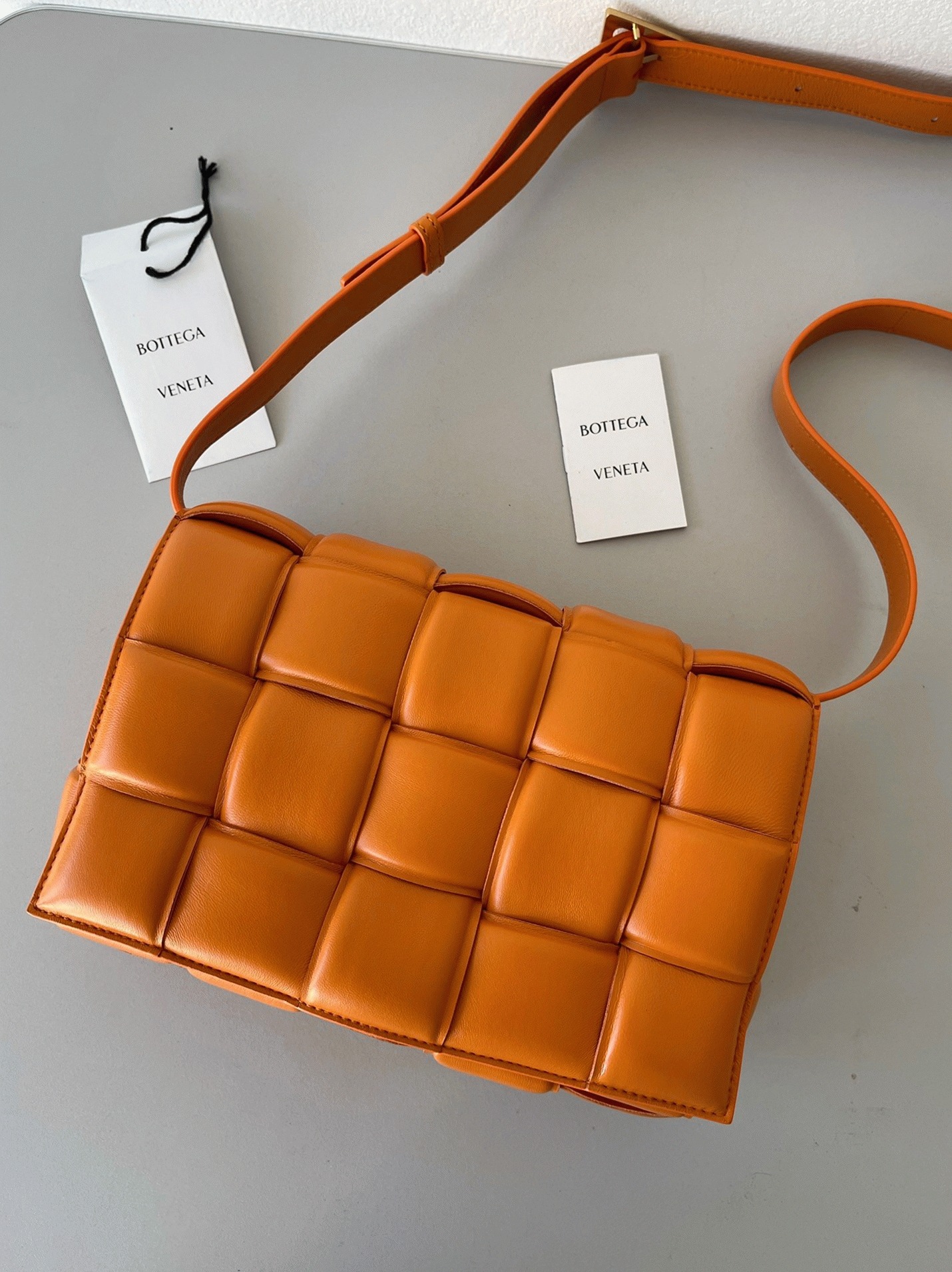 Top Quality Faux B0tt*ga Ven*ta Padded Cassette Bag In Orange